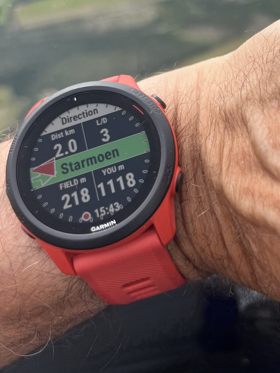 GlideRange on the wrist over Norwegian terrain from the cockpit.